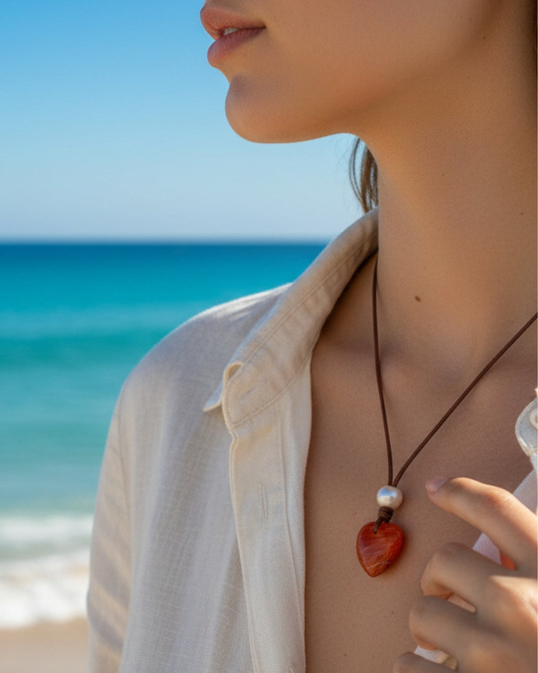 Wendy Mignot Orange Lions Paw Shell Heart and Freshwater Pearl and Leather Saba Love Necklace