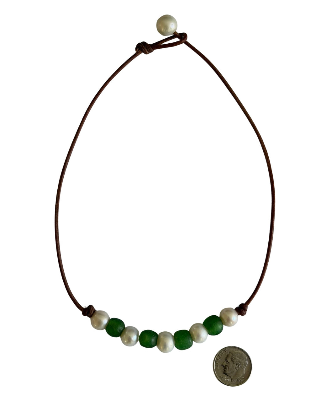 Wendy Mignot Fine Pearls and Leather Jewelry beaded necklace with brown leather cord, white pearls, and green beads.
