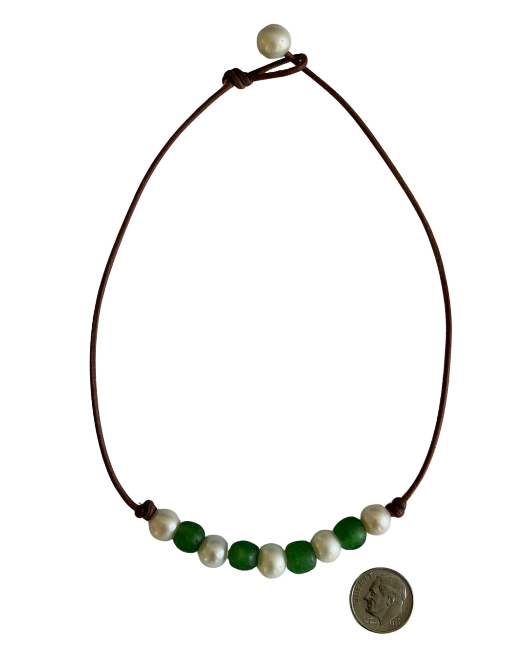 Wendy Mignot Fine Pearls and Leather Jewelry beaded necklace with brown leather cord, white pearls, and green beads.
